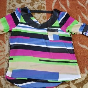 Multi-colored blouse with faux leather detail.